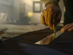 CU PAN Shot of man measuring out his fabric with ruler / South Africa Stock Footage