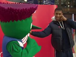Anthony Joshua Poses with Commonwealth Mascot News Clip