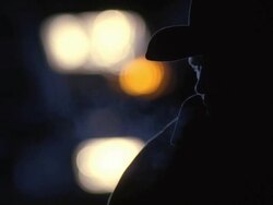  CU Cowboy blowing smoke in dark  / Tejon Ranch, California, USA Stock Footage