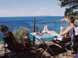 WS Couple Having Breakfast On The Beach Stock Footage