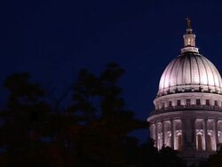 MS Lit capitol building at night through trees / Madison, Wisconsin, United States Stock Footage