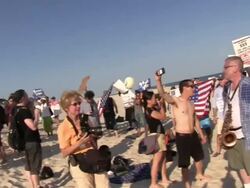 Mitt Romney/Koch Fundraiser Protestors on Beach Stock Footage