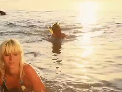 HD: Couple Swimming At Sunset Stock Footage