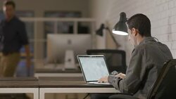 Two young entrepreneur businessmen working late in the office Stock Footage