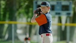Medium slow motion shot of baseball player pitching / American Fork, Utah, United States Stock Footage