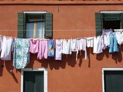 WS Shot of clothes hang to dry at front of house in Arsenale / Venice, Veneto, Italy Stock Footage