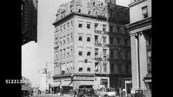 1934: NEW YORK CITY: HD: TU WS Columbus Circle street sign on pole, Angled WS Manhattan corner building w/ cars & double-decker bus moving on street. MS '2 Columbus Circle' address painted on glass. Instructional Video