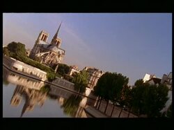 WA Notre Dame Cathedral reflected in water, Paris, angled Stock Footage