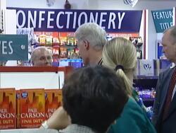 Bill Clinton goes shopping during airport stopover Stock Footage
