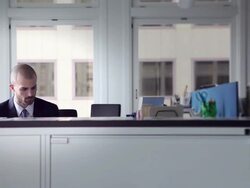 MS DS Businessman sitting in office workstation examining documents Stock Footage