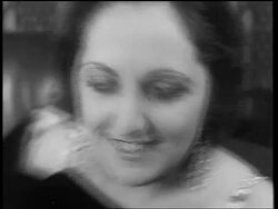 B/W 1933 close up drunk woman with large earrings laughing / end of Prohibition Stock Footage