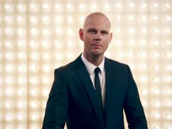 Man in front of lightwall Stock Footage