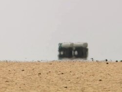 WS TS View of abstract various same trucks running in desert / Djibouti Stock Footage