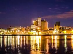 HD Time Lapse: Industrial Buildings at Night Stock Footage