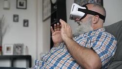 adult senior man and a virtual reality headset. graybearded man using vr glasses Stock Footage