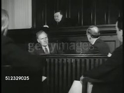 1937: WAGNER ACT TESTED: COURTROOM REPRISAL: Newspaper headline: 'Mill operators Assail Legality of Wagner Act' EXT Kansas City Court building. INT Court w/ judge stating ruling SOT, his Opinion that the law is Unconstitutional. Instructional Video