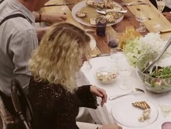 Friends and family eating at an outdoor dinner party Stock Footage