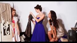 Three women choose what to wear Stock Footage