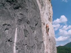 CRANE: Man Climbing A Rock Stock Footage