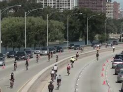 WS Cyclists on highway / Chicago, Illinois, USA Stock Footage