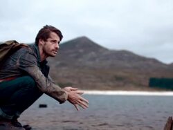 Backpacker resting at a lake Stock Footage