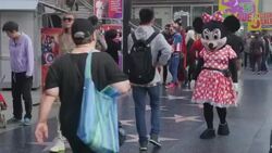 2015 Oscar Prep is Underway, Micky Mouse Solicits Photo with Tourists Stock Footage