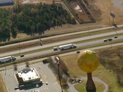 MS AERIAL Shot of Peachoid Water Tower with parking area / South Carolina, United States Stock Footage