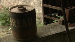 An old container sits on a ledge. Stock Footage