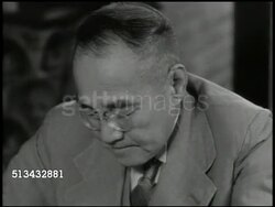 1946: SHIGERU YOSHIDA: INT VS Prime Minister of Japan Shigeru Yoshida (1878-1967) sitting at desk, signing papers. VS Japanese officials (possibly of National Diet of Japan) sitting in office talking w/ Yoshida. Instructional Video