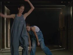 two dancers dancing together in wooden barn as they get closer to camera Stock Footage