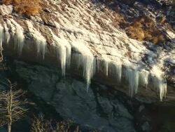 MS AERIAL ZO Shot of frozen waterfalls on chimney top mountain / North Carolina, United States Stock Footage