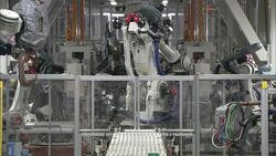 Robots operate in an automotive factory. Stock Footage