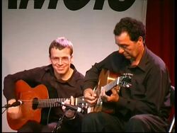 Gypsy jazz guitarist Fapi Lafertin and rhythm guitarist performing, France Stock Footage