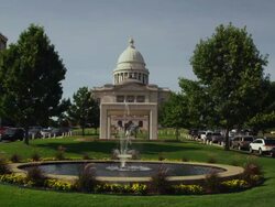 Wide shot of Arkansas State Capitol building with water fountain in foreground Stock Footage