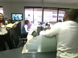 Staff working in 702 Talk Radio newsroom News Clip