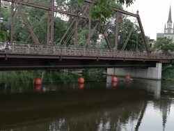 WS Two young girls running on bridge / Minneapolis, Minnesota, United States Stock Footage