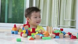 Child with wood toy Stock Footage