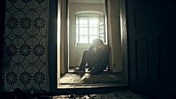 Despaired woman in an abandoned house Stock Footage