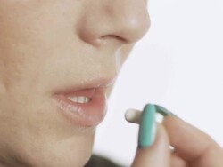 HD SLOW MOTION: Woman Taking A Pill Stock Footage