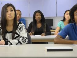 Confident Female Student Interacts in Classroom Setting Stock Footage