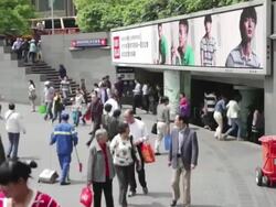 MS Shot of Chinese crowd near subway / Shanghai, China Stock Footage