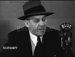 1944: NEW YORK CITY: Journalist Walter Winchell sitting at desk behind 'blue' microphone reading script saying anyone thinking US too cruel to Germany should think of cruelty inflicted by them to our soldiers & millions of starved & mutilated people. Instructional Video