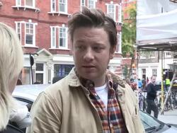 Jamie Oliver sighted outside the BBC talking about Robbie Williams Stock Footage
