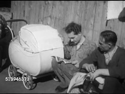 1953: REFUGEES: BERLIN, GERMANY: VS Various East Berlin refugees sitting outside in camp, male rocking baby stroller, various other refugees around, children playing. Berlin Wall, occupied city Instructional Video