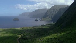 Small islets lie within Kalaupapa National Park, a remote area including the north central coast of Molokai. The national park protects many threatened and endangered species endemic to the Hawaiian islands. Stock Footage