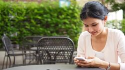 Young woman using mobile phone Stock Footage