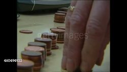 Charity shop workers counting coins and sort clothes donated for tsunami victims News Clip