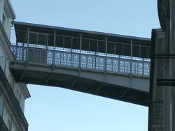 CU View of Footbridge from Santa Justa Elevator and one man crossing bridge / Lisbon, Lisbon, Portugal Stock Footage