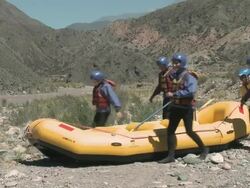 Group of people carrying raft Stock Footage