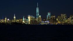 Statue of Liberty, One World Trade Center and Downtown Manhattan across the Hudson River, New York, Manhattan, United States of America - Time lapse Stock Footage